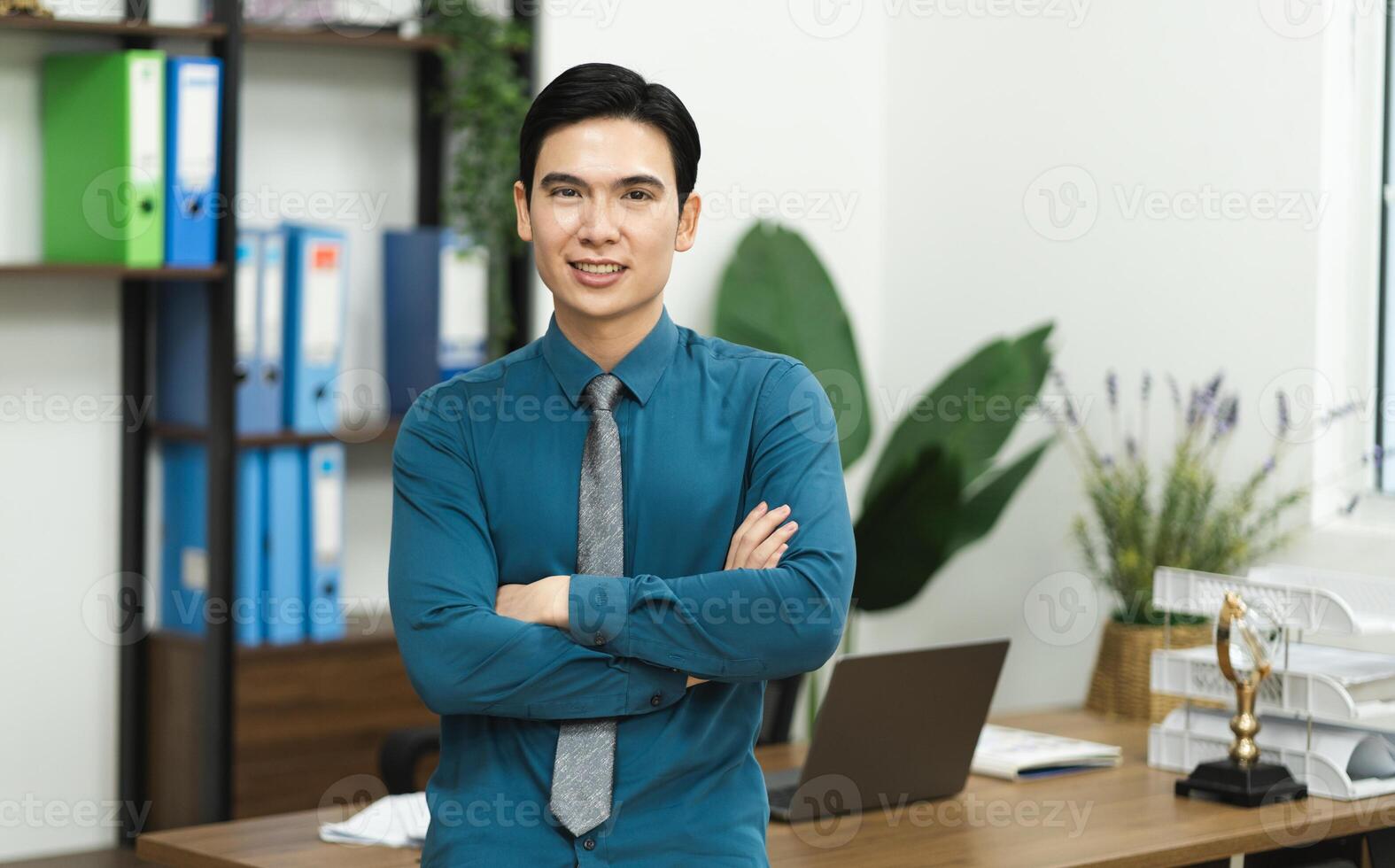 Image of Asian male businessman working in the office photo