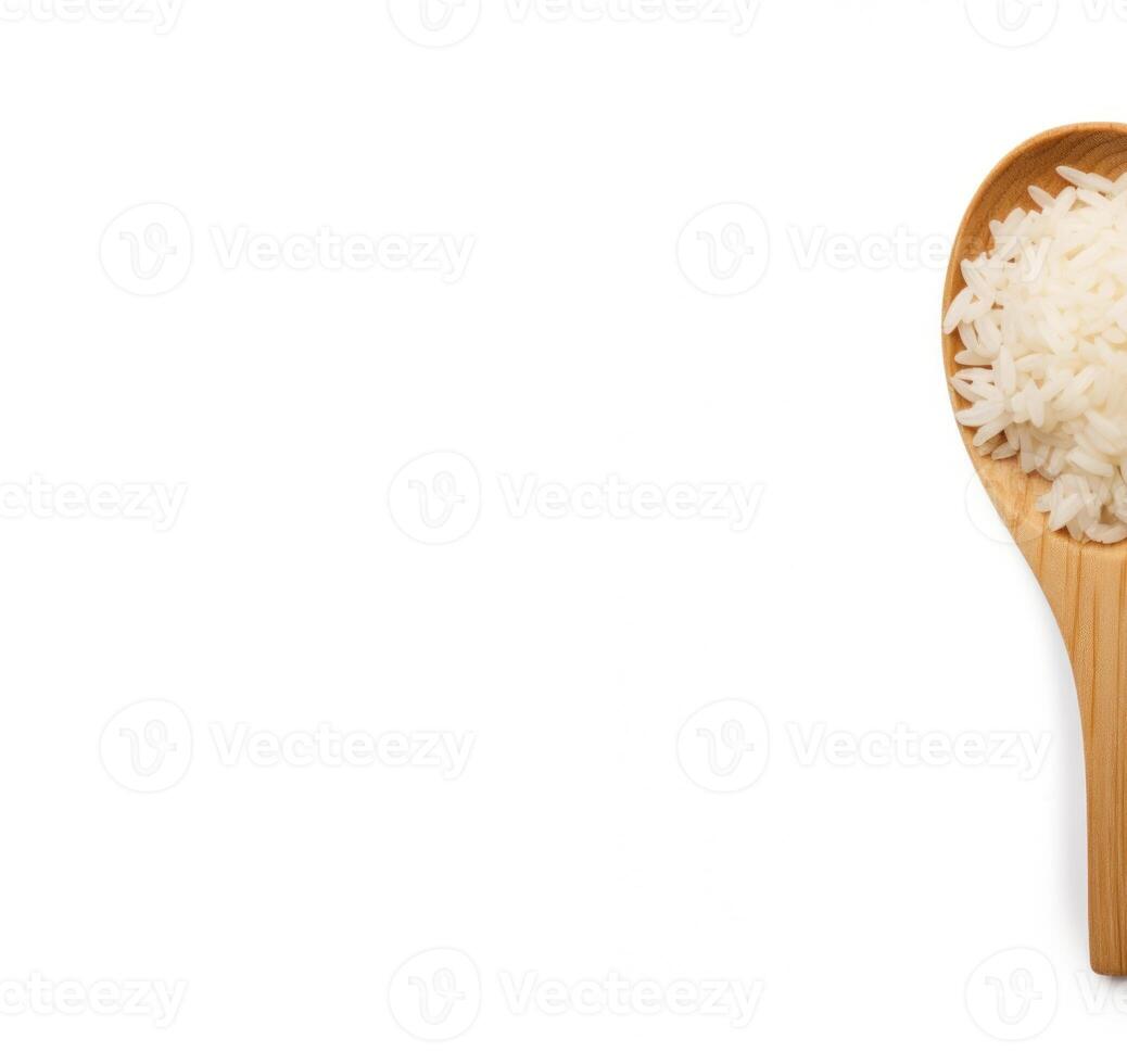 half raw white rice on wooden spoon top view photo