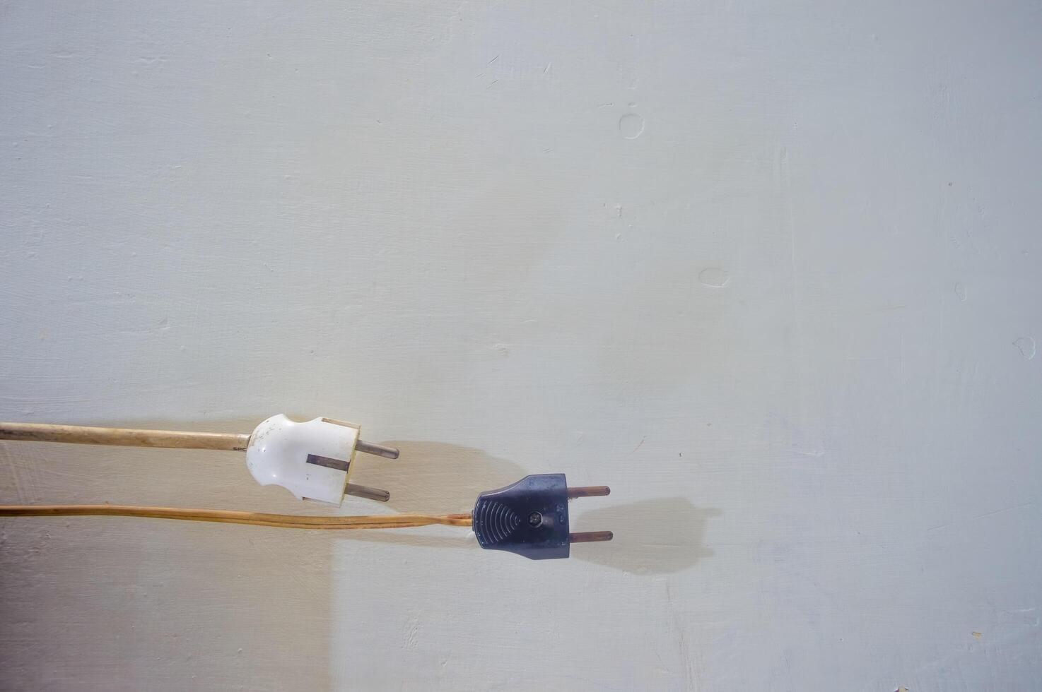 background of two electrical plugs with plain white copy space or negative space photo