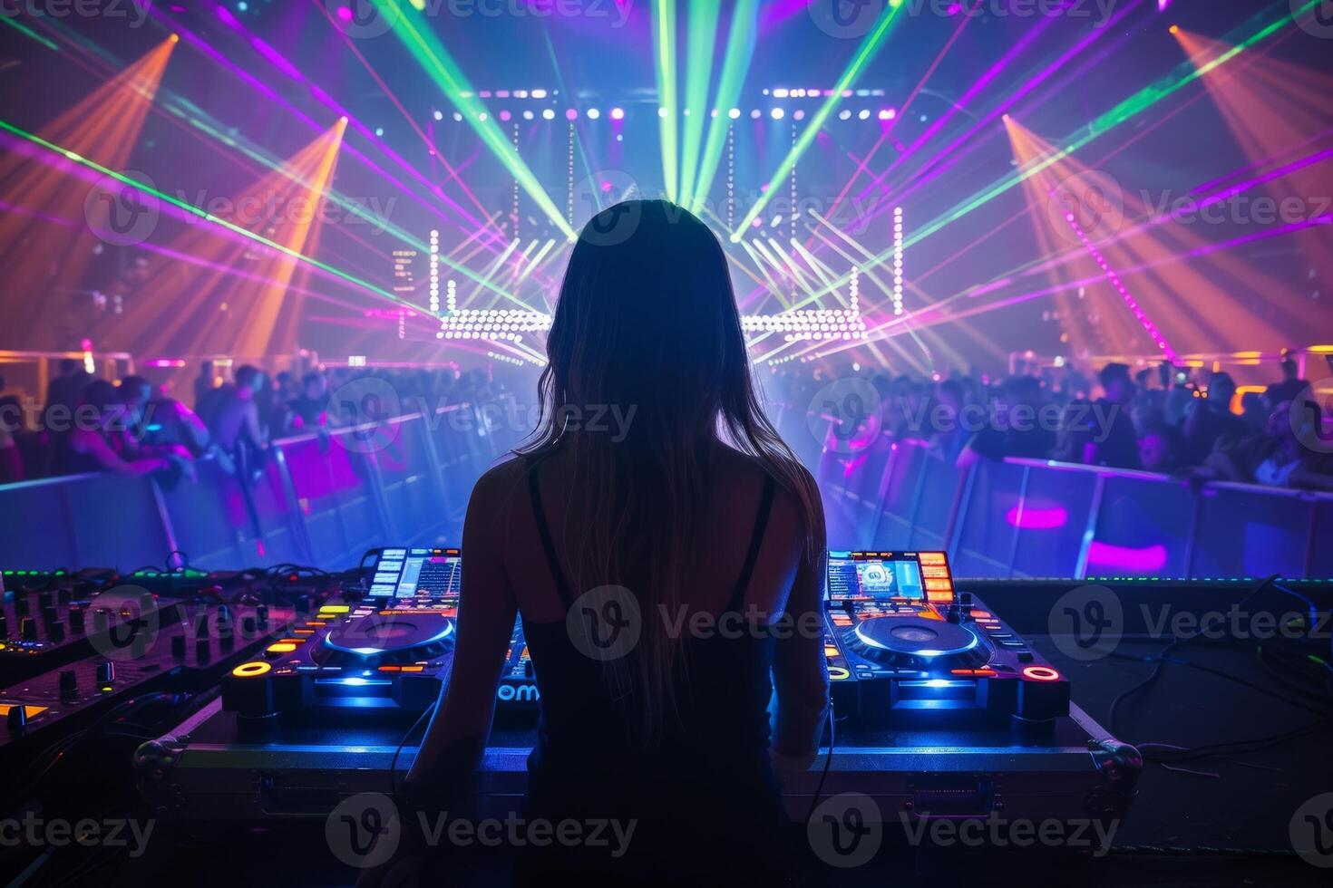 Female DJ on a big rave playing for a big crowd of party people, ravers dancing, big laser show photo