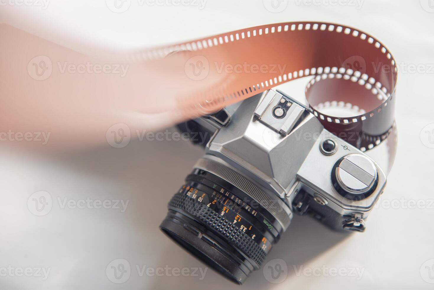 SLR 35mm vintage camera and roll negative film photo