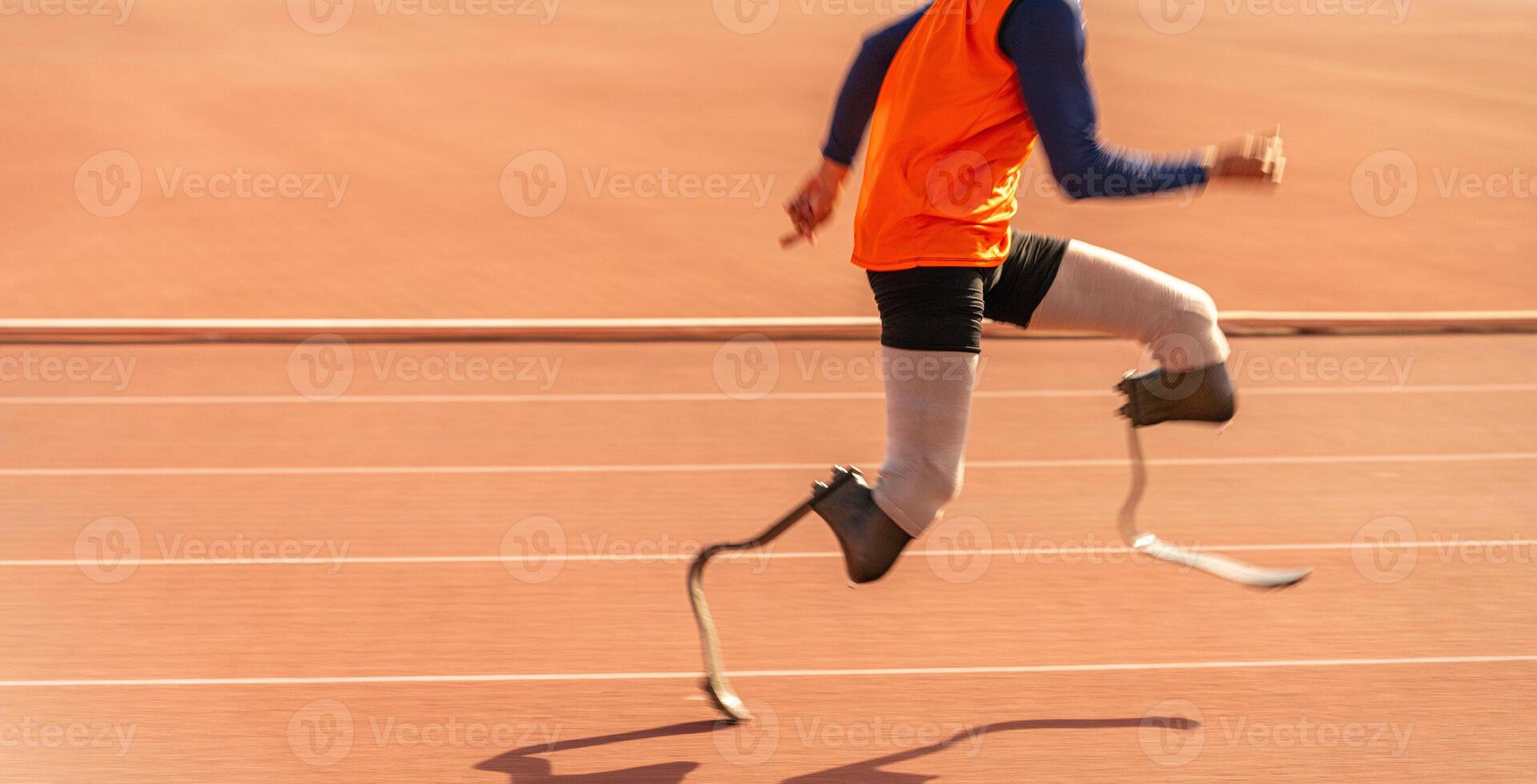 Asian para-athlete runner prosthetic leg on the track alone outside on a stadium track Paralympic running concept. photo