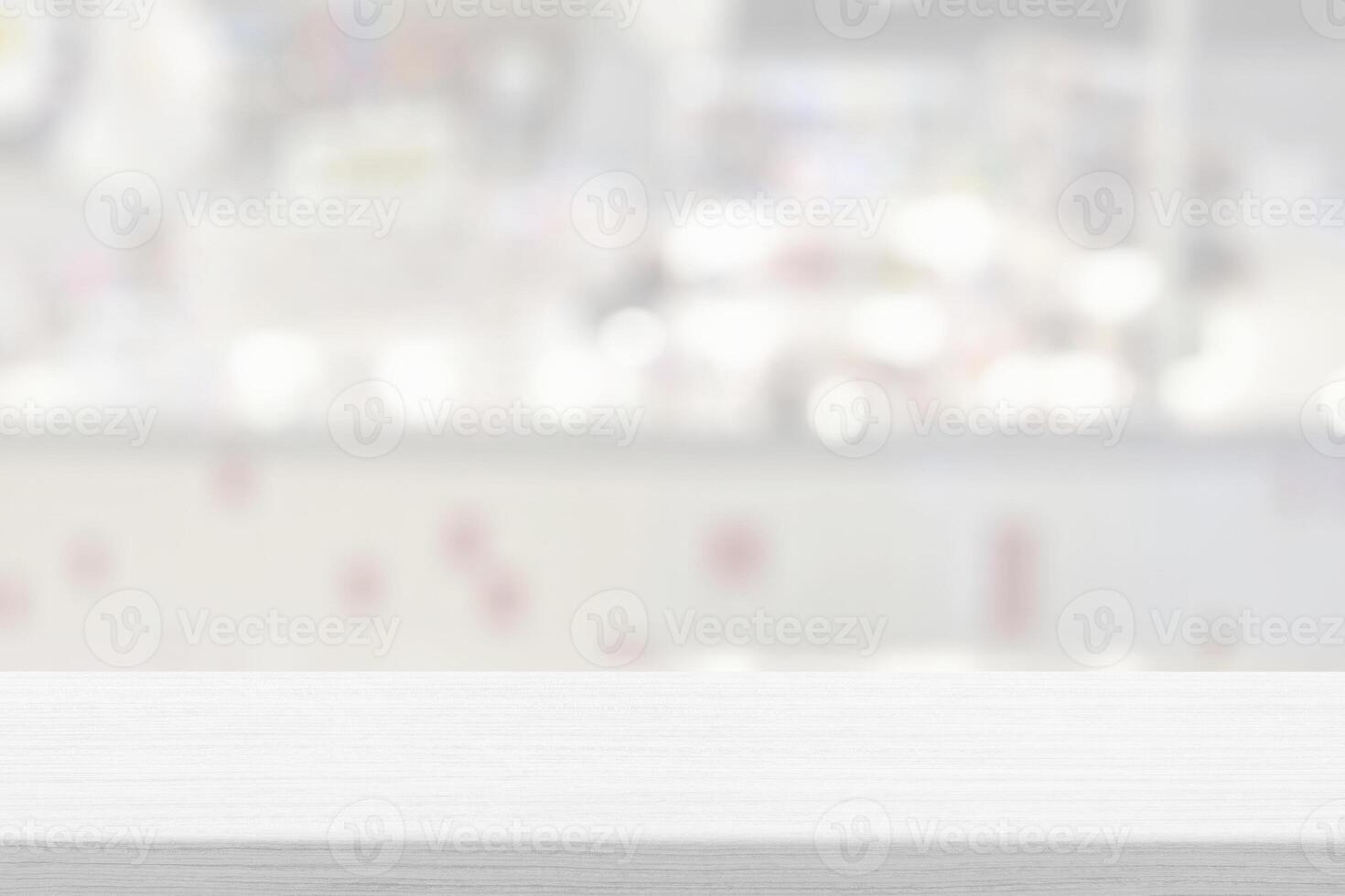Wooden table white blurred bokeh of coffee shop background photo