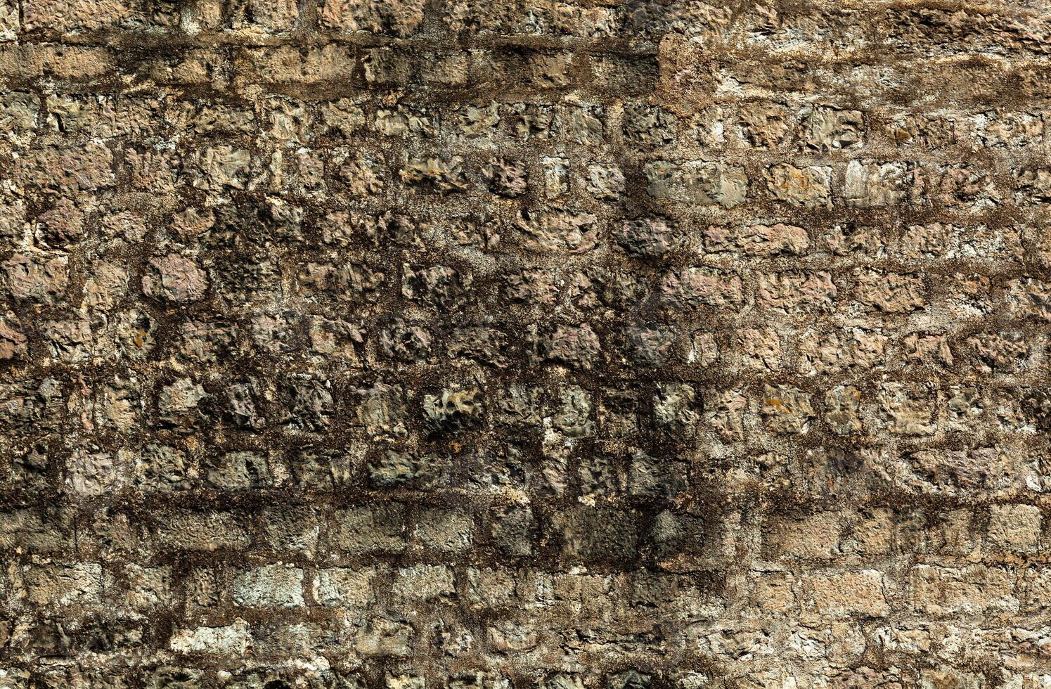 Stone texture of a wall in Montenegro. Ancient wall composed of brown coloured stones. Wet sweat from water is covered with mould. Background. Template. For design. Horizontal. photo