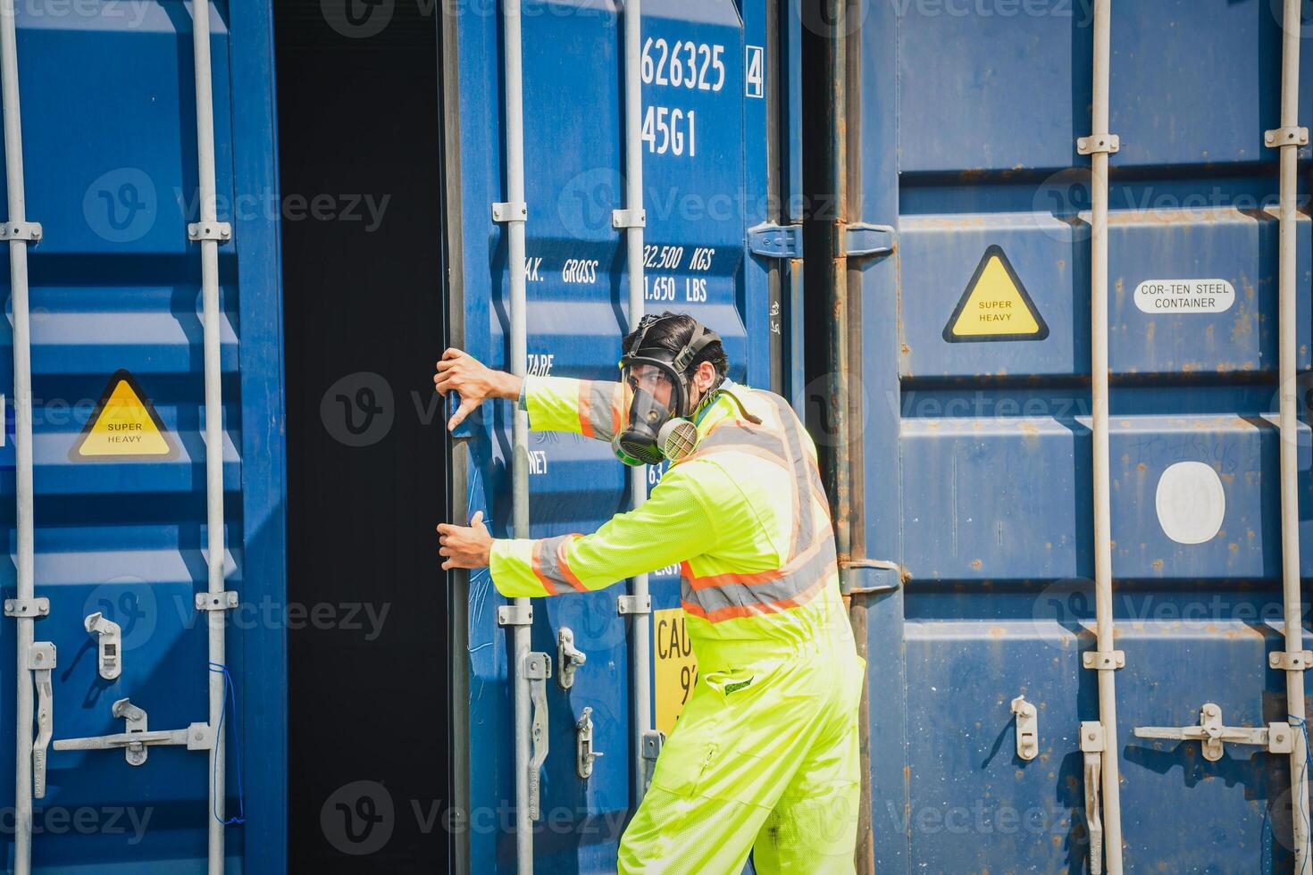 Engineer wear PPE checking inside container as Chemical spill in the container shipping industry photo