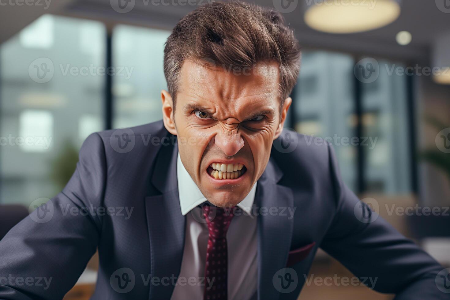Angry middle aged boss in the office. Portrait of furious businessman. photo