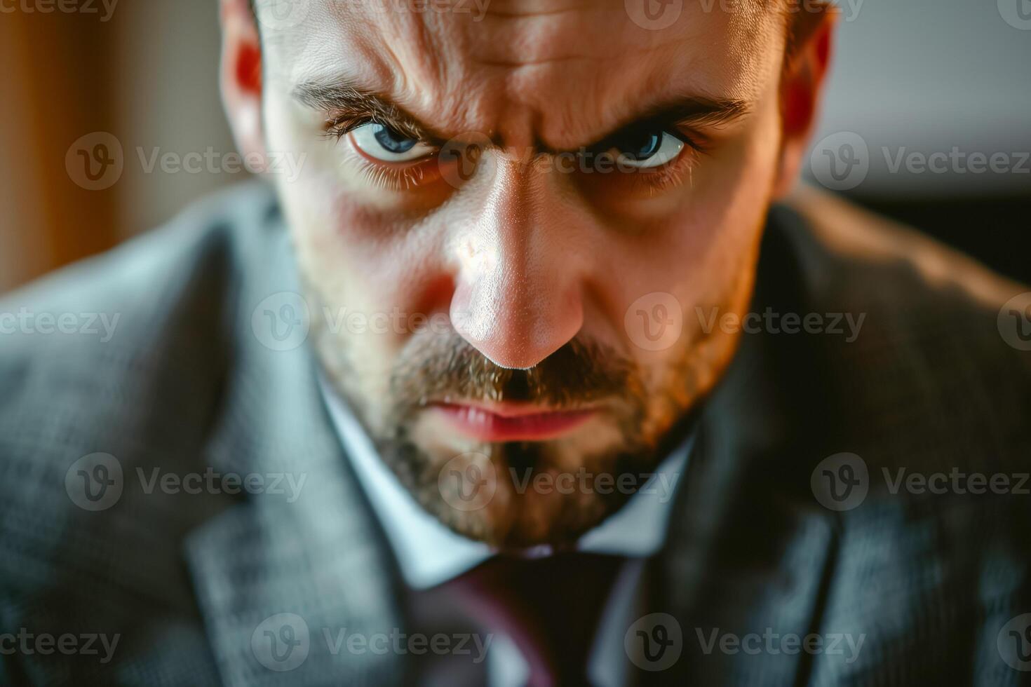 Angry young boss in the office. Furious businessman, closeup. photo