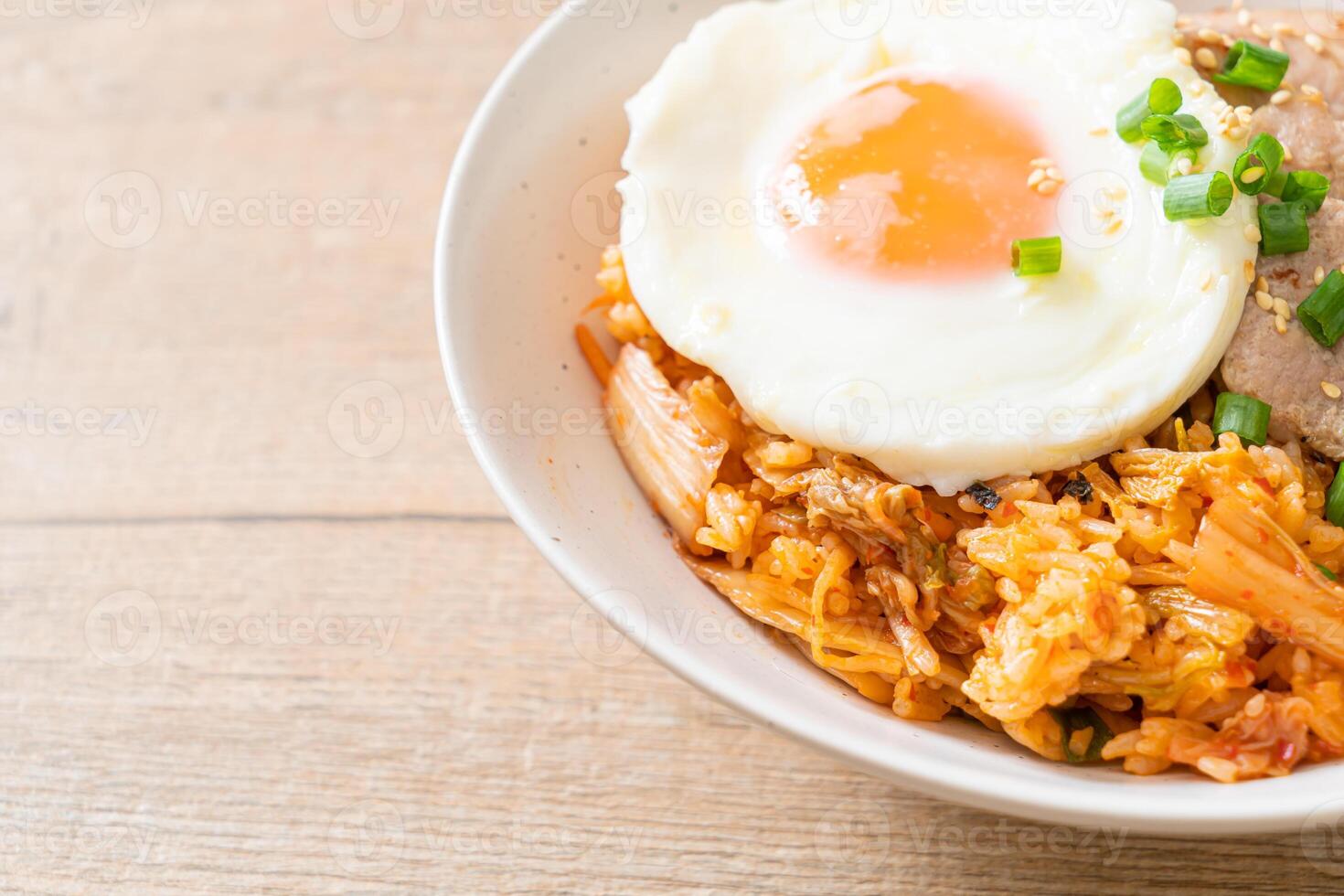 Kimchi fried rice with fried egg and pork photo