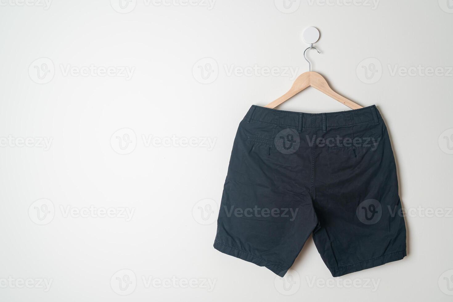 short pants hanging on wall photo