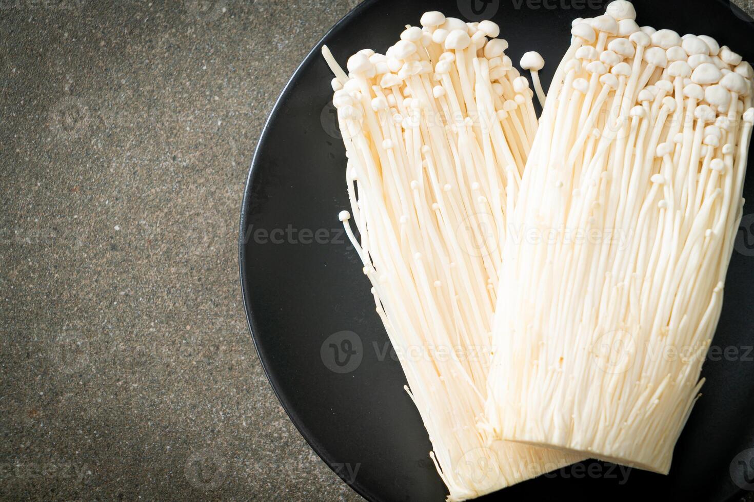 fresh enoki mushroom or golden needle mushrooms photo