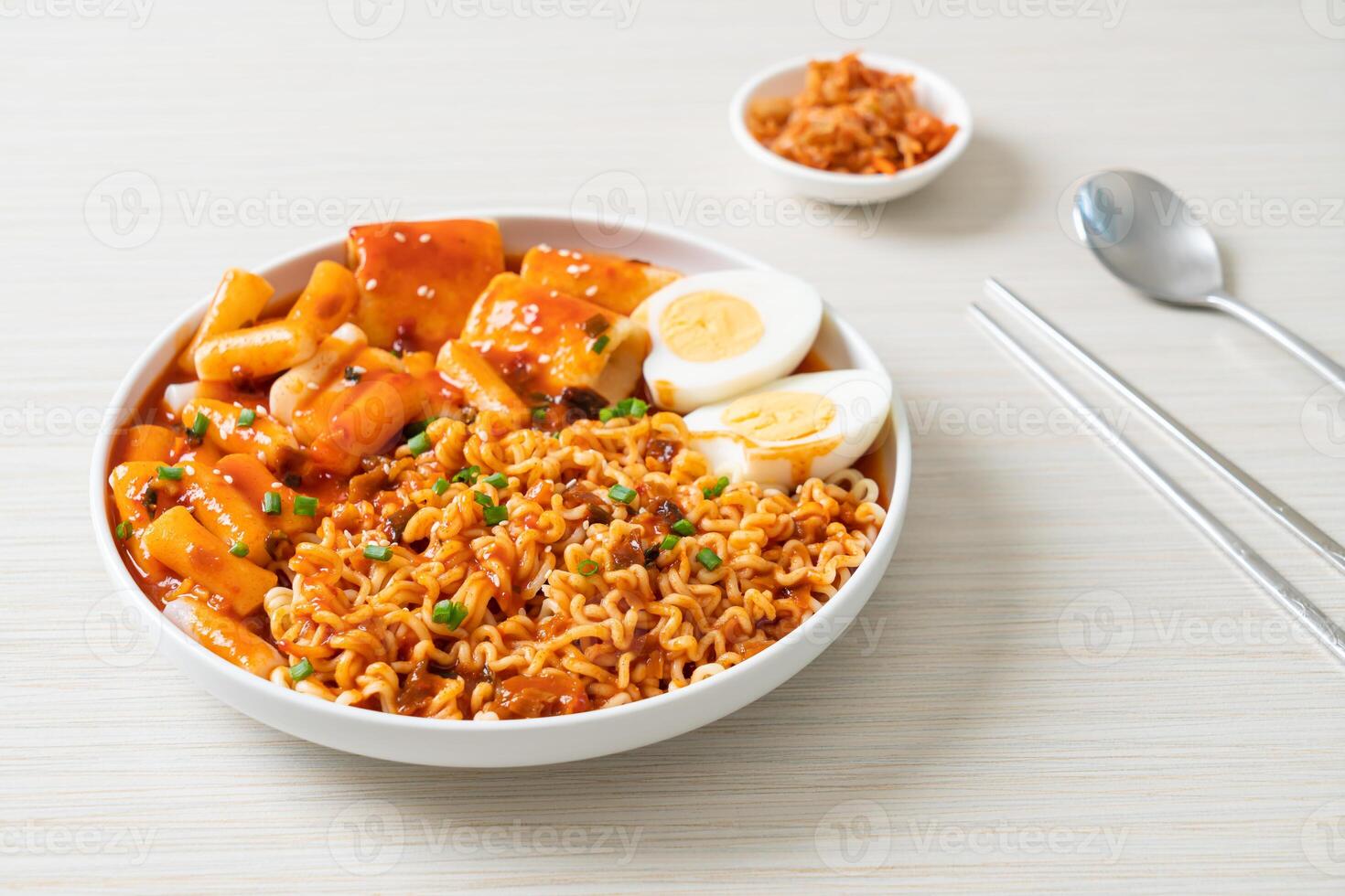 Korean instant noodles with Korean rice cake and fish cake and boiled egg photo