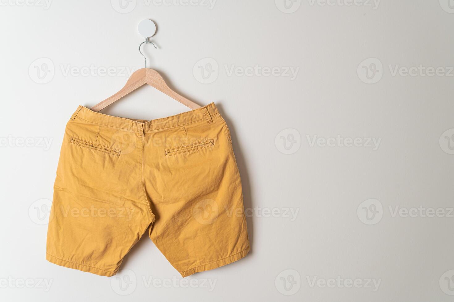 short pants hanging on wall photo