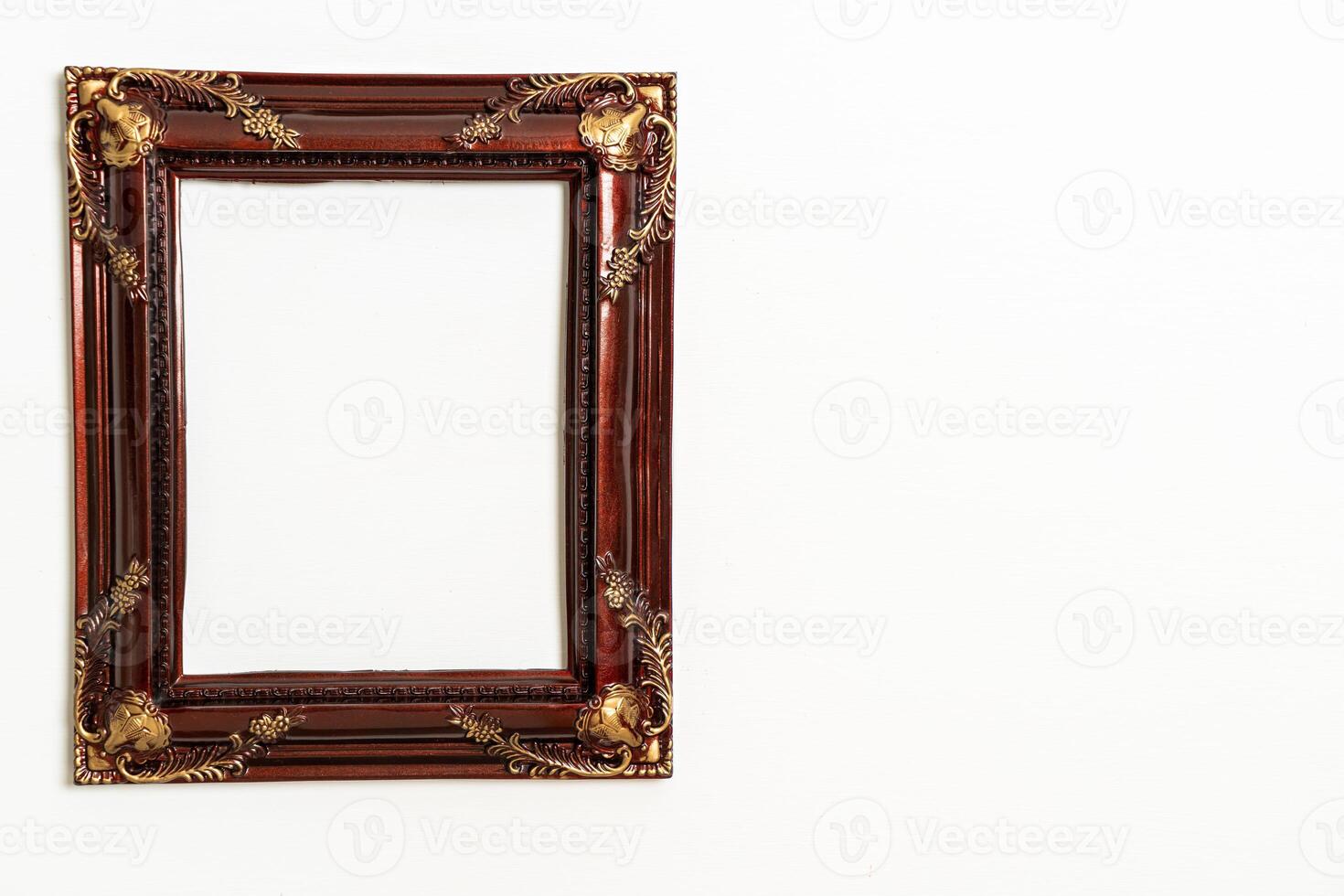 empty picture frame on white wall background photo