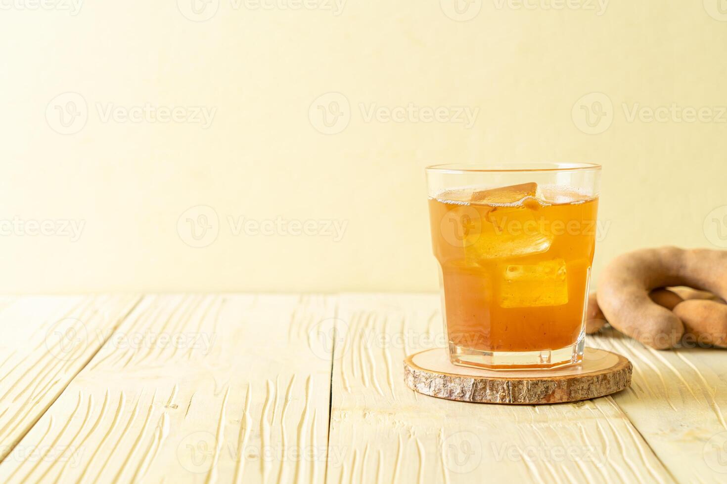 Delicious sweet drink tamarind juice and ice cube photo