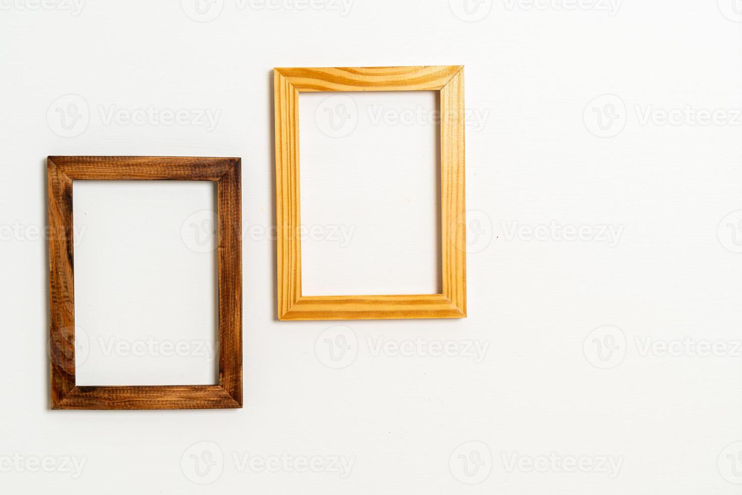 empty picture frame on white wall background photo