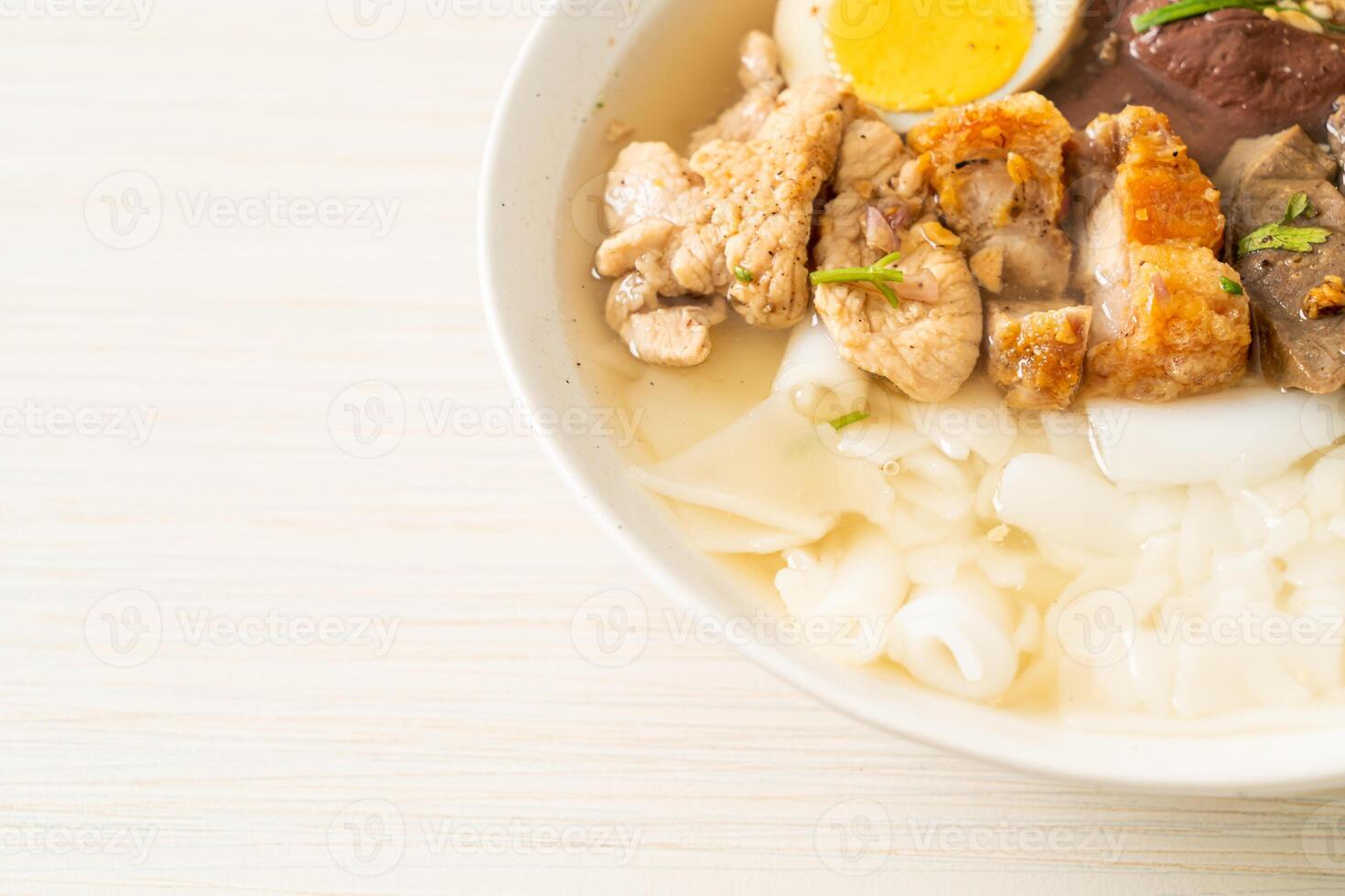 paste of rice flour or boiled Chinese pasta square in clear soup photo