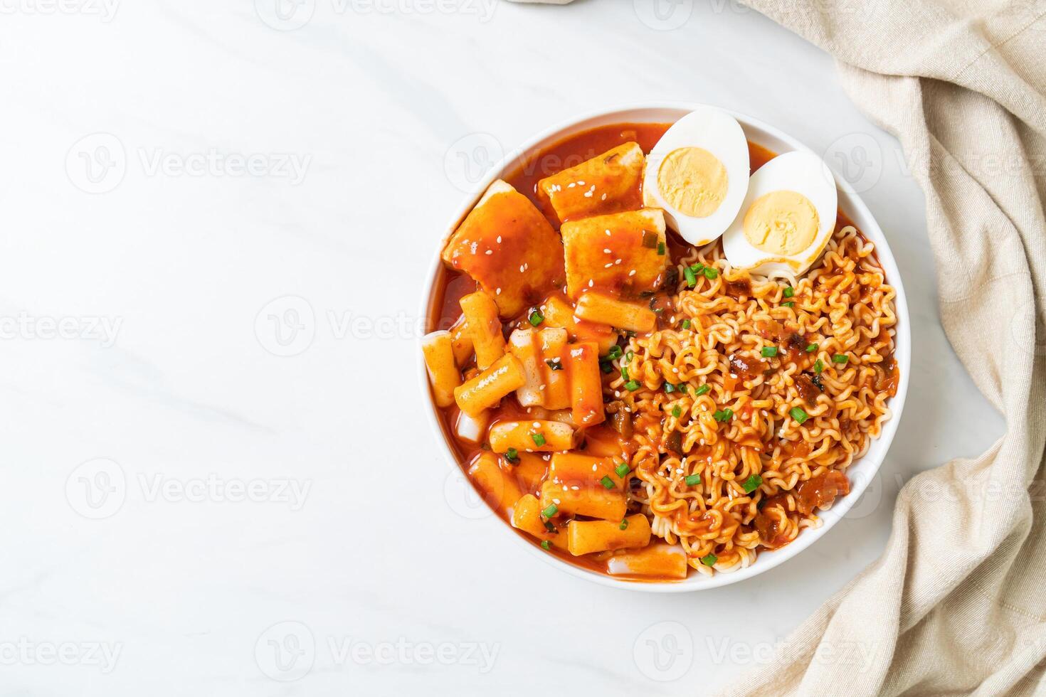 Korean instant noodles with Korean rice cake and fish cake and boiled egg photo