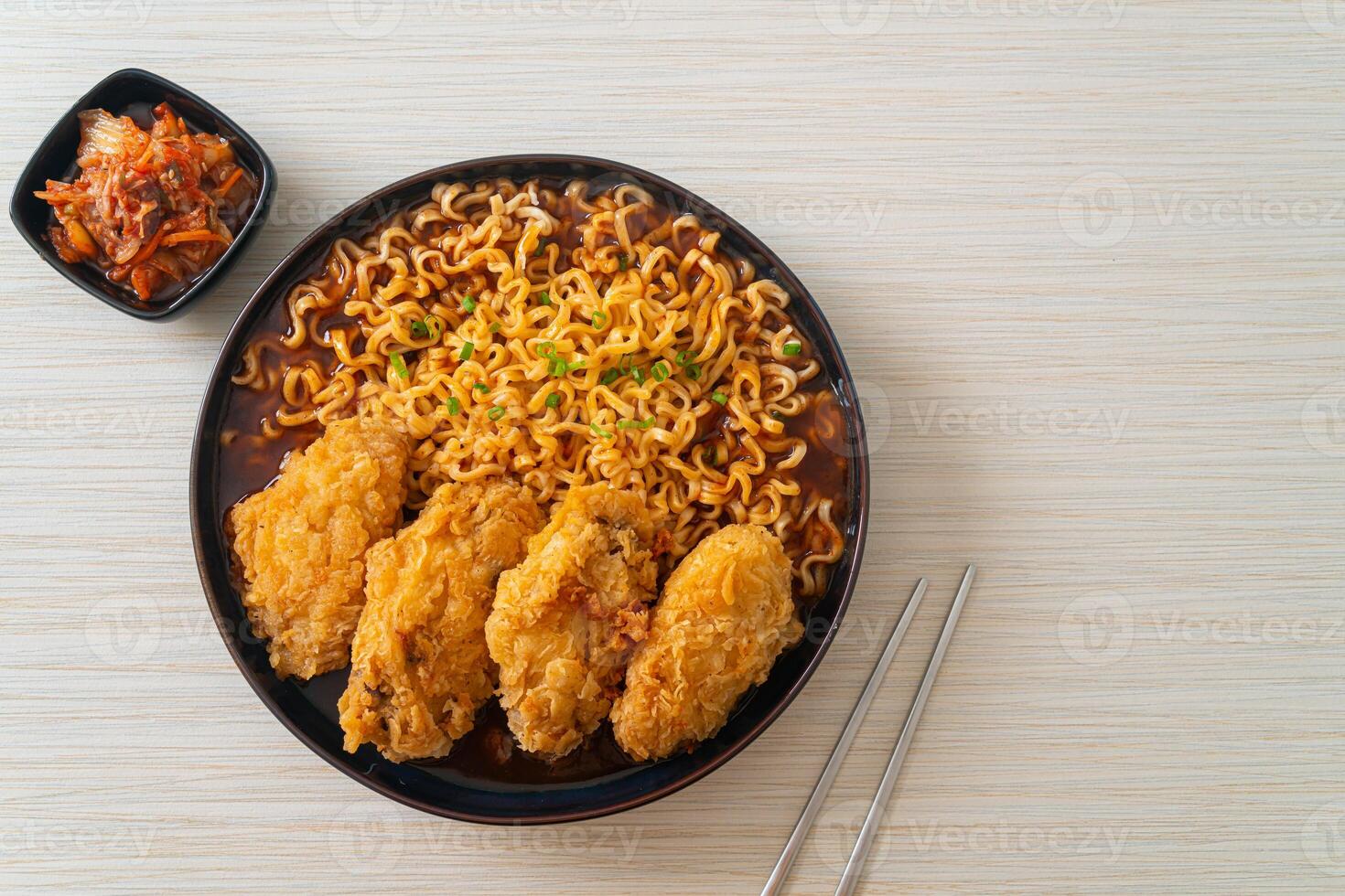 Korean instant noodles with fried chicken or Fried chicken ramyeon photo