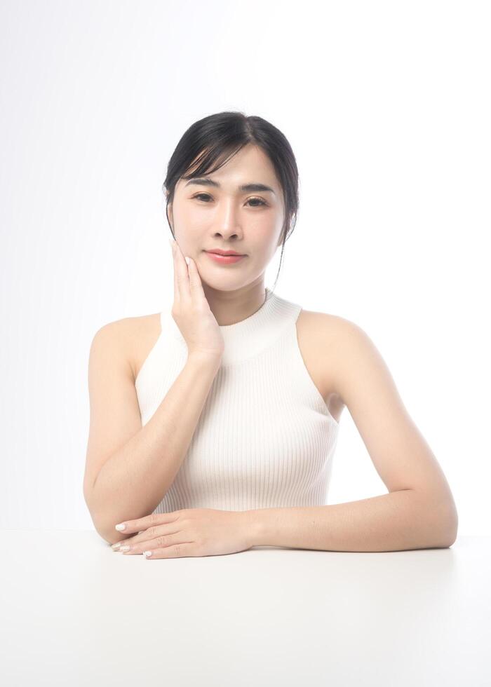 A portrait of young beautiful woman face with smooth healthy skin on white background , Skincare concept photo