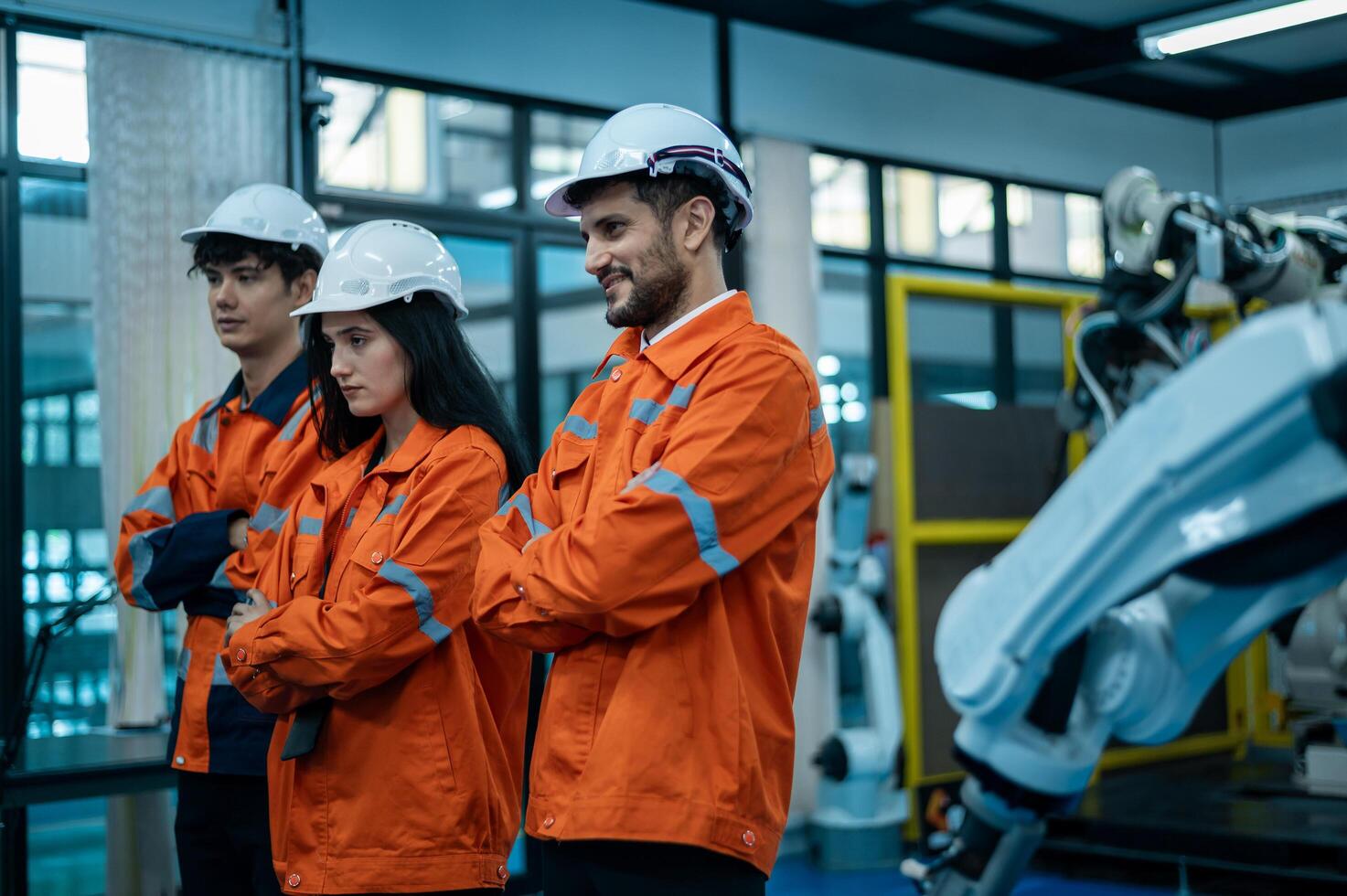 retrato de robótica ingenieros trabajando con programación y manipulando robot mano, industrial robótica diseño, alto tecnología instalación, moderno máquina aprendiendo. masa producción automáticas. foto