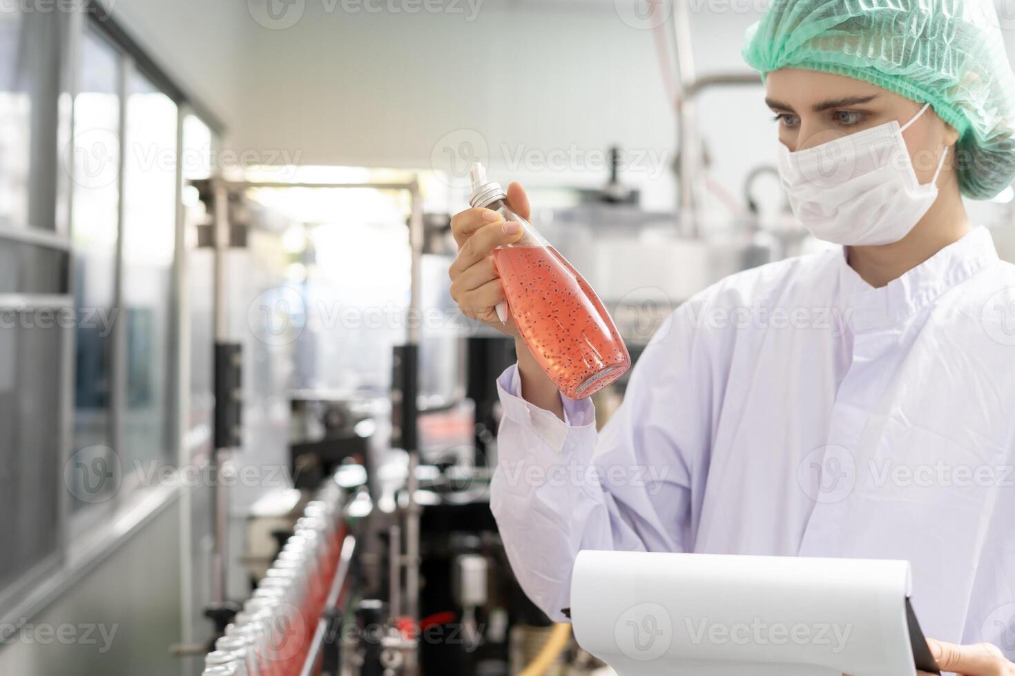 quality inspector food or beverages technician inspection about quality control food or beverages before send product to the customer. Production leader recheck ingredient and productivity. photo