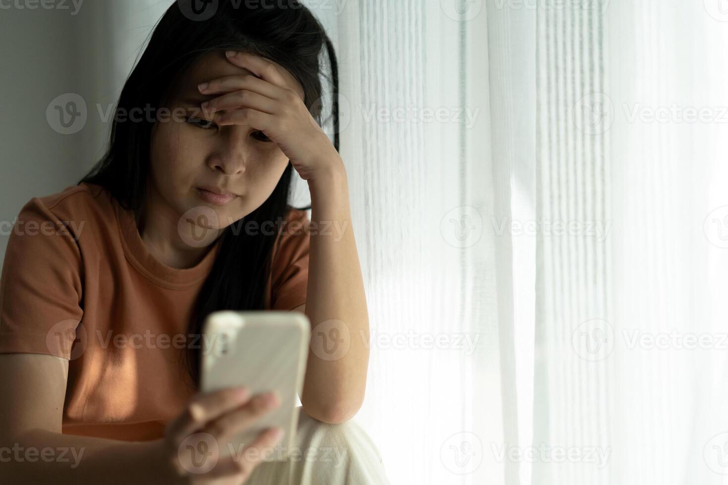 Depression and mental illness. Asian woman disappointed, sad after receiving bad news. Stressed girl confused with unhappy problems, arguing with boyfriend, cry and worry about unexpected pregnancy. photo
