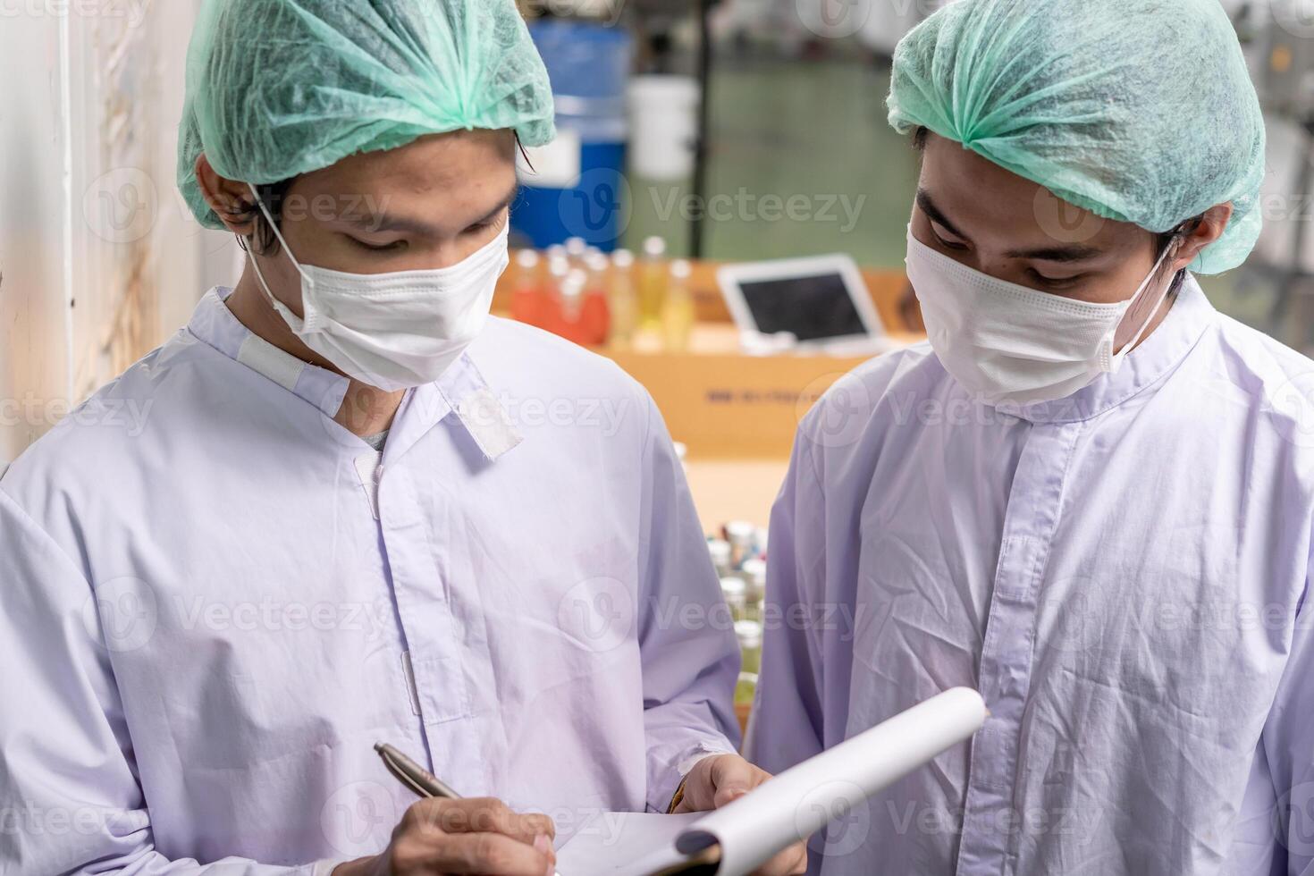 quality supervisor food or beverages technician inspection about quality control food or beverages before send product to the customer. Production leader recheck ingredient and productivity. photo