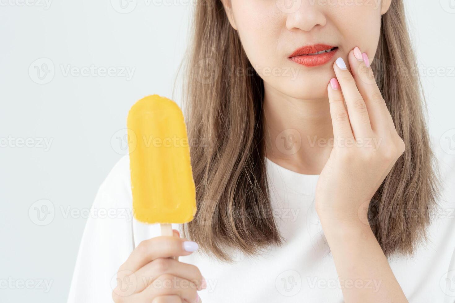 Asian woman feel sensitive teeth after eating ice cream, female suffer tooth, decay problems, dental care, tooth extraction, decay problem, bad breath, Gingival Recession, Oral Hygiene instruction photo