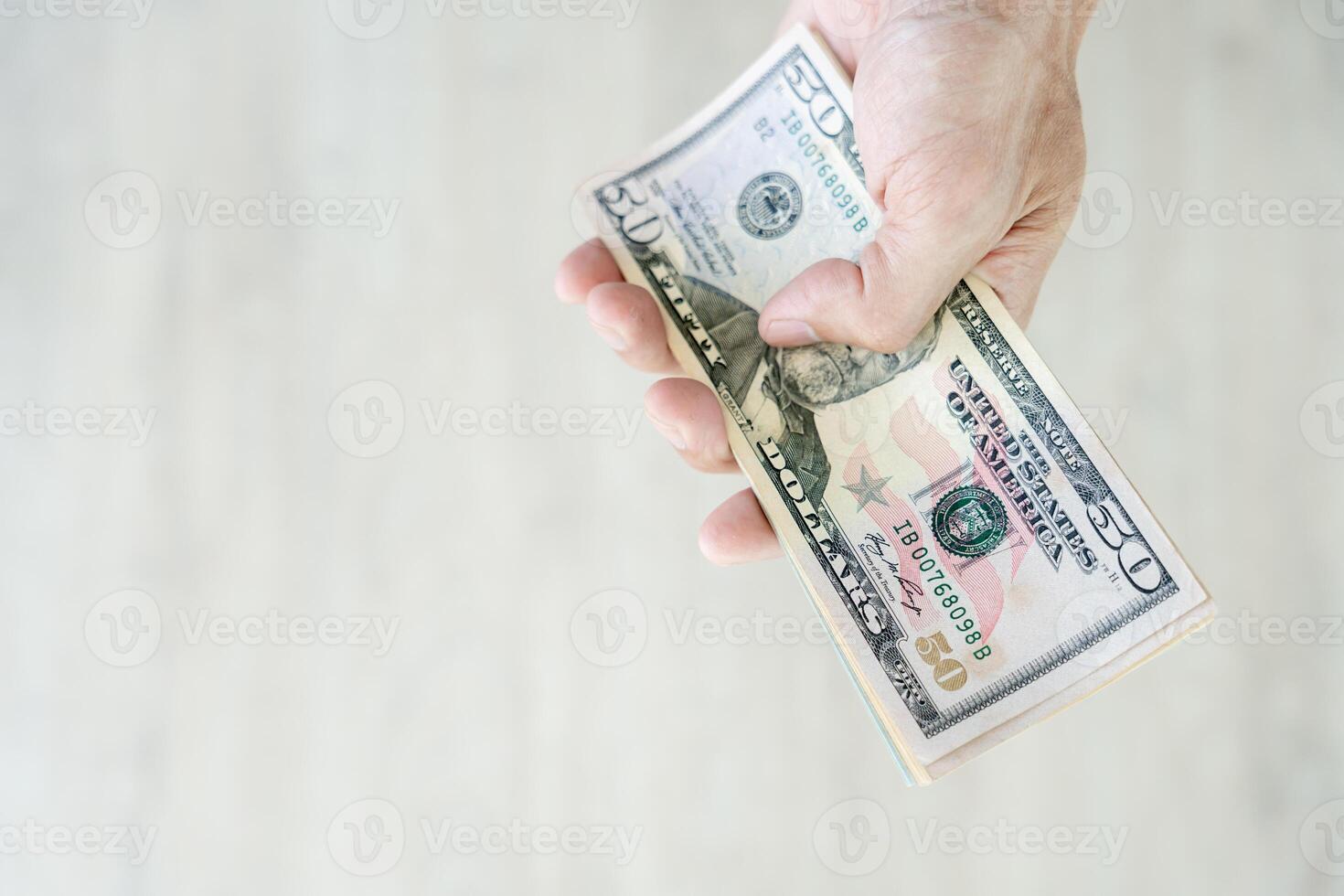 USD currency , Many dollar bank notes Placed on the table.The  Dollar is the currency of USA that is used to change, buy, sell, accumulate, and invest in united kingdom's state people. photo