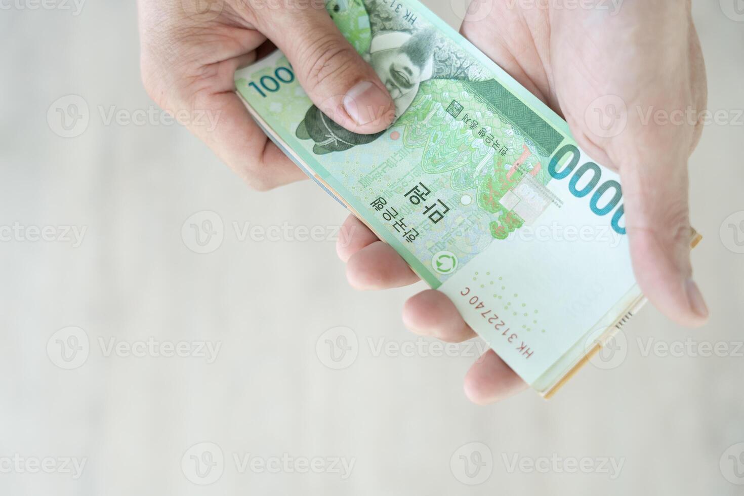 The currency of Korea which is used to represent value in exchange and the won is the main currency of Korean people. Korean won notes for money concept background. photo