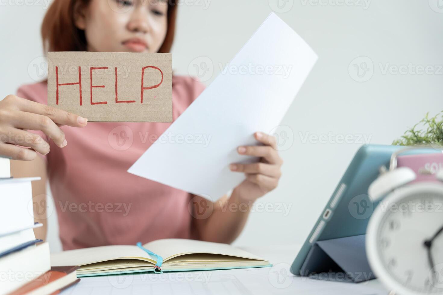 Asian student woman have anxiety because of exams, female prepare for test and learning lessons in the library. stress, despair, haste, misunderstanding reading, discouraged, expectation, knowledge photo