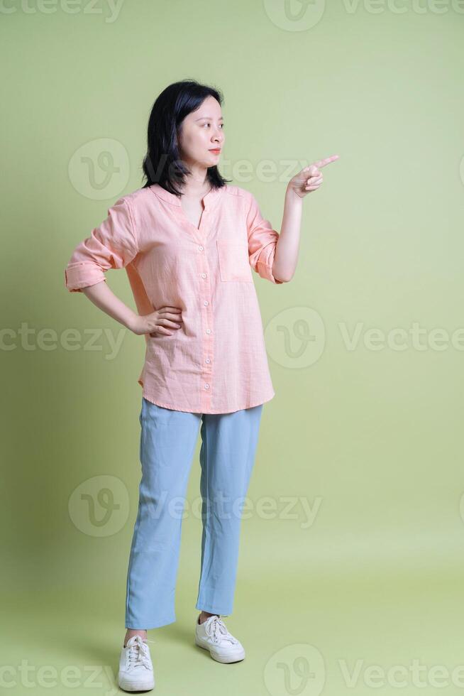 Photo of young Asian woman on background