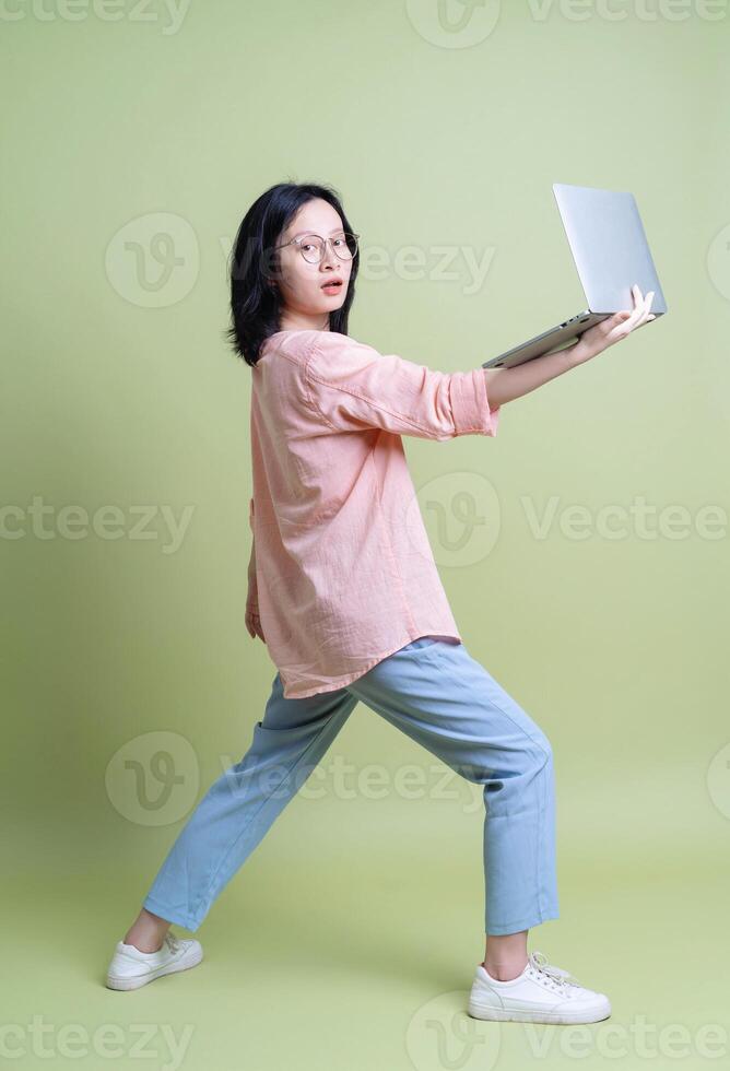 Photo of young Asian woman on background