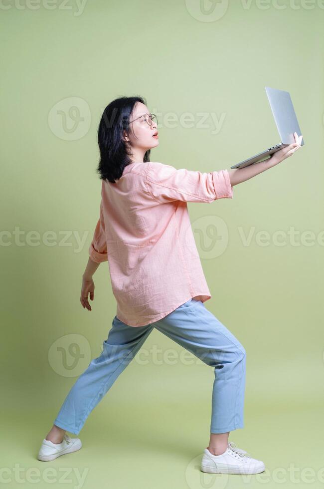 Photo of young Asian woman on background