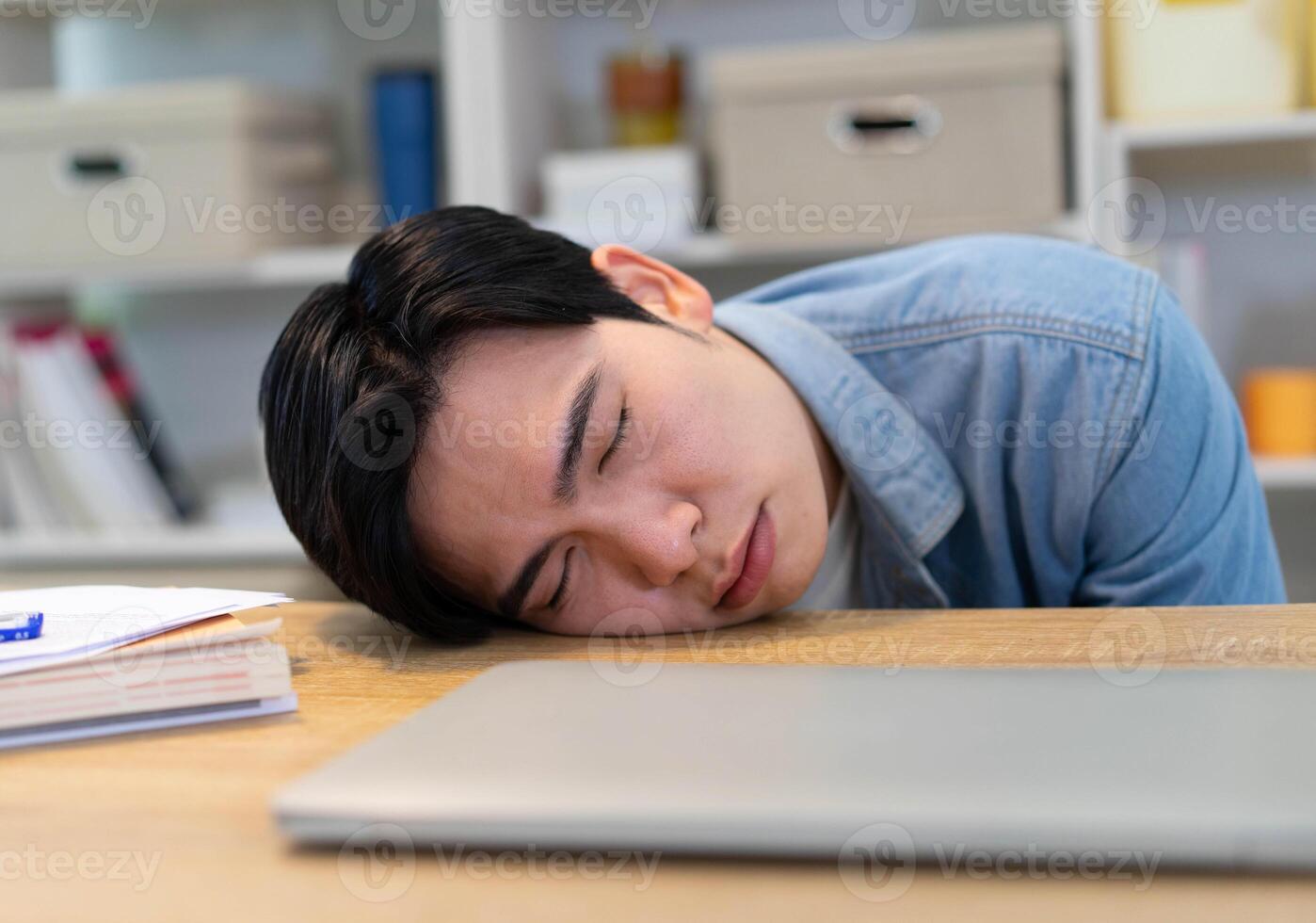 Young Asian businessman working at home photo