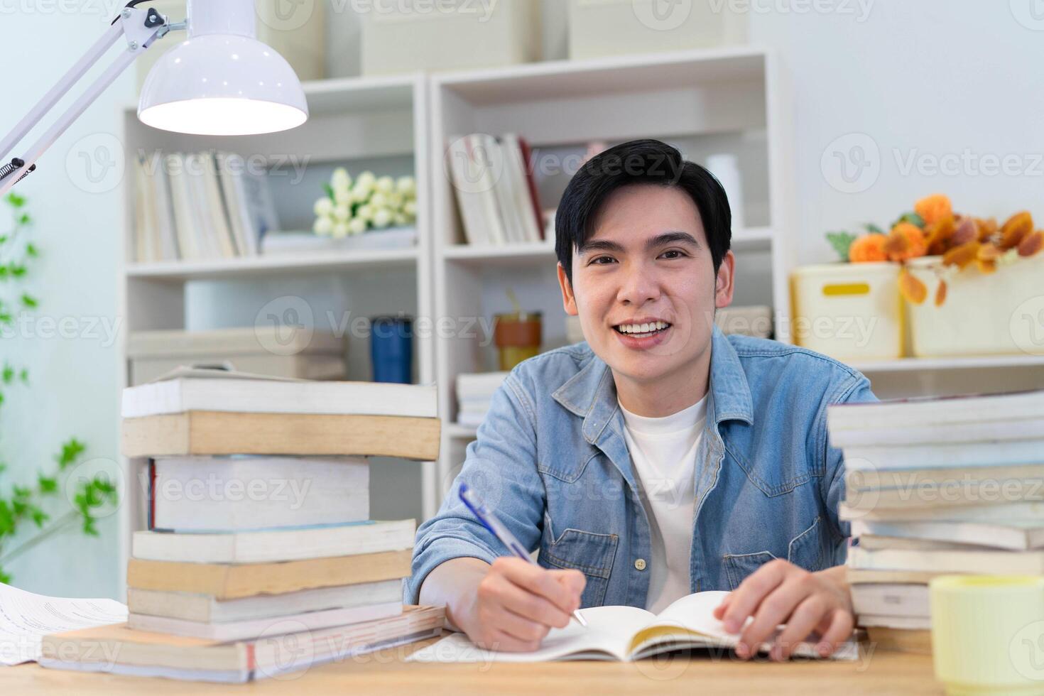 Young Asian businessman working at home photo