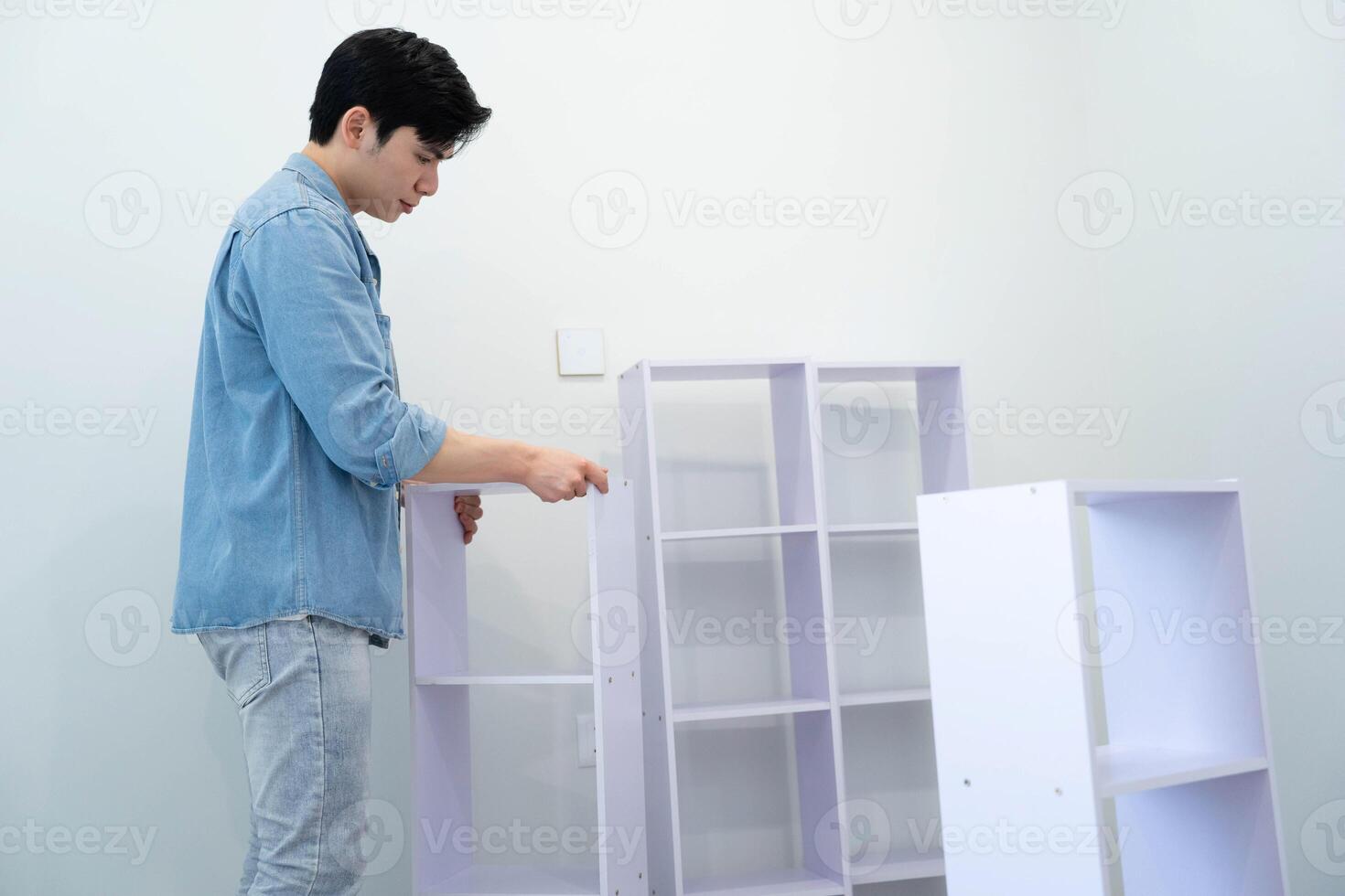 Asian man measuring and repairing houses photo