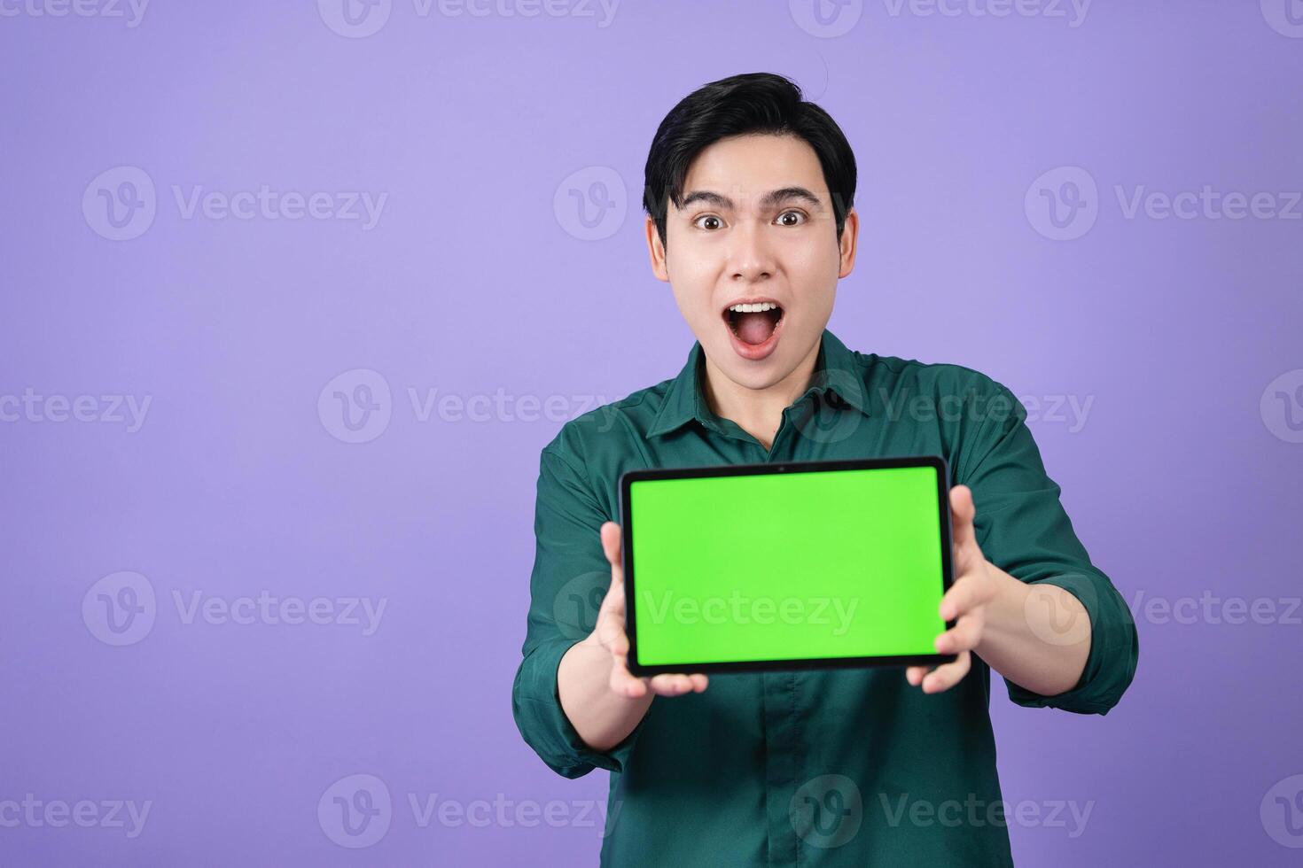 Young Asian business man holding tablet on background photo