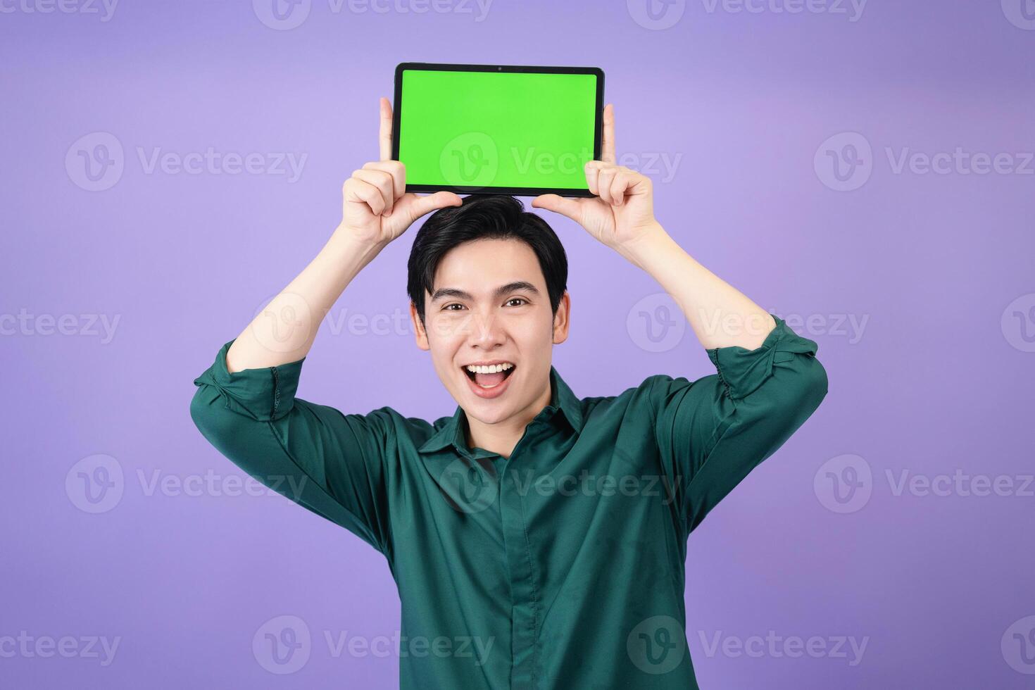 Young Asian business man holding tablet on background photo