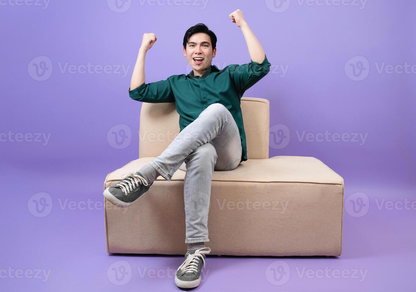 Young Asian businessman on purple background photo