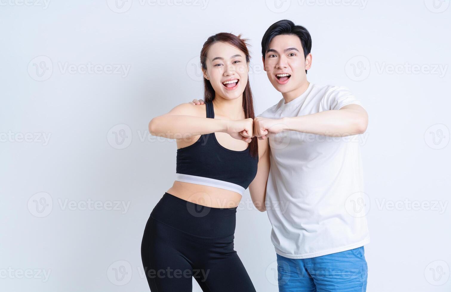 Young Asian couple on background photo