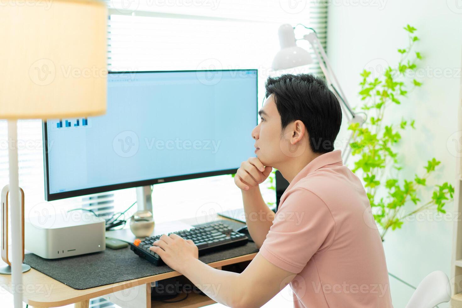 Photo of young Asian man at home