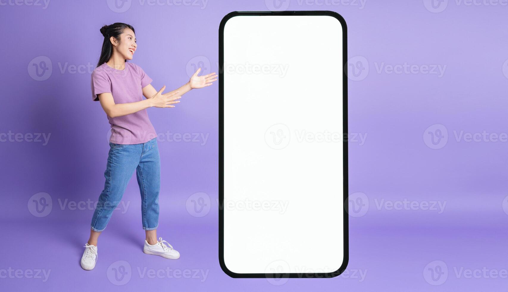 Photo of young Asian girl on purple background