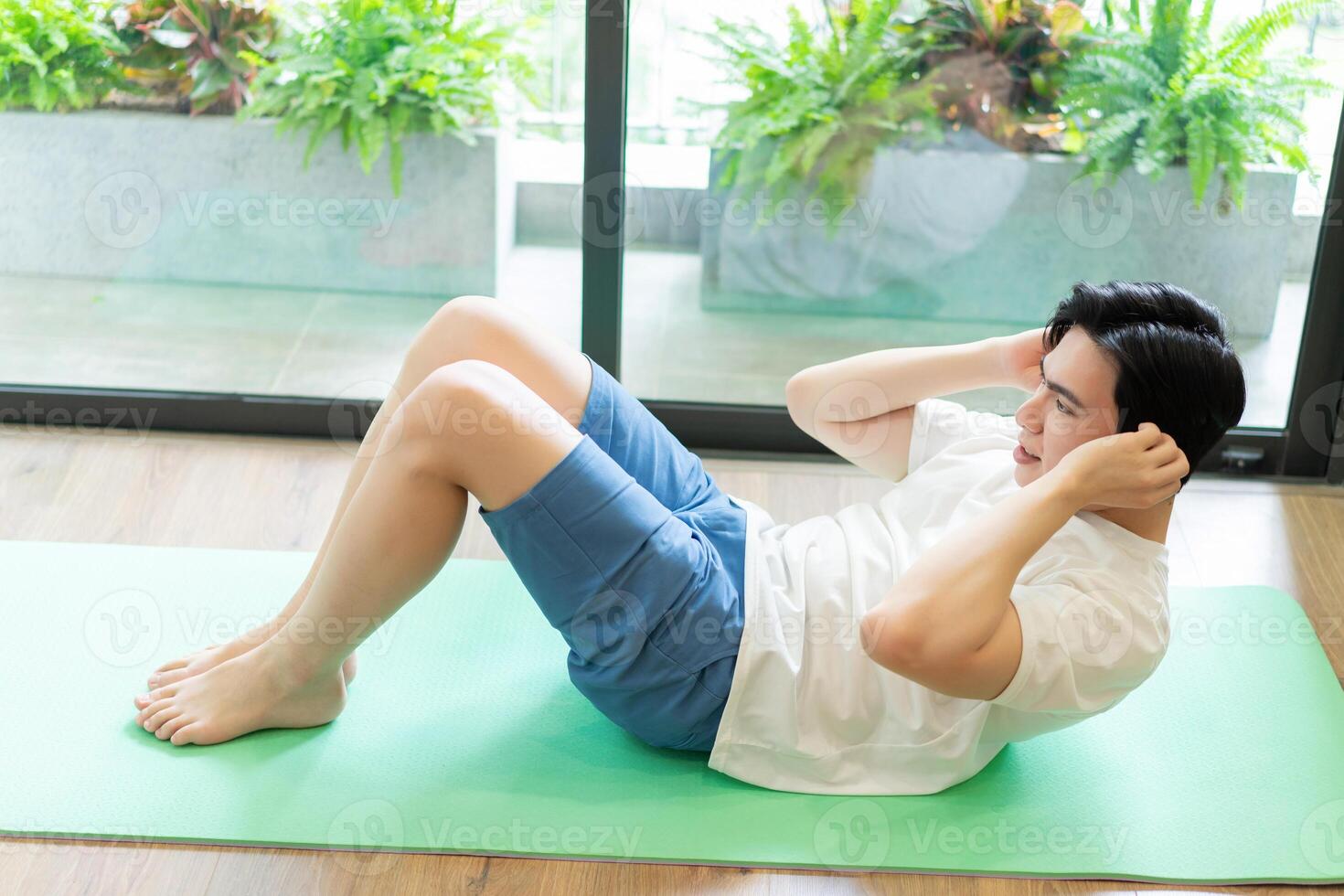 Photo of young Asian man at home