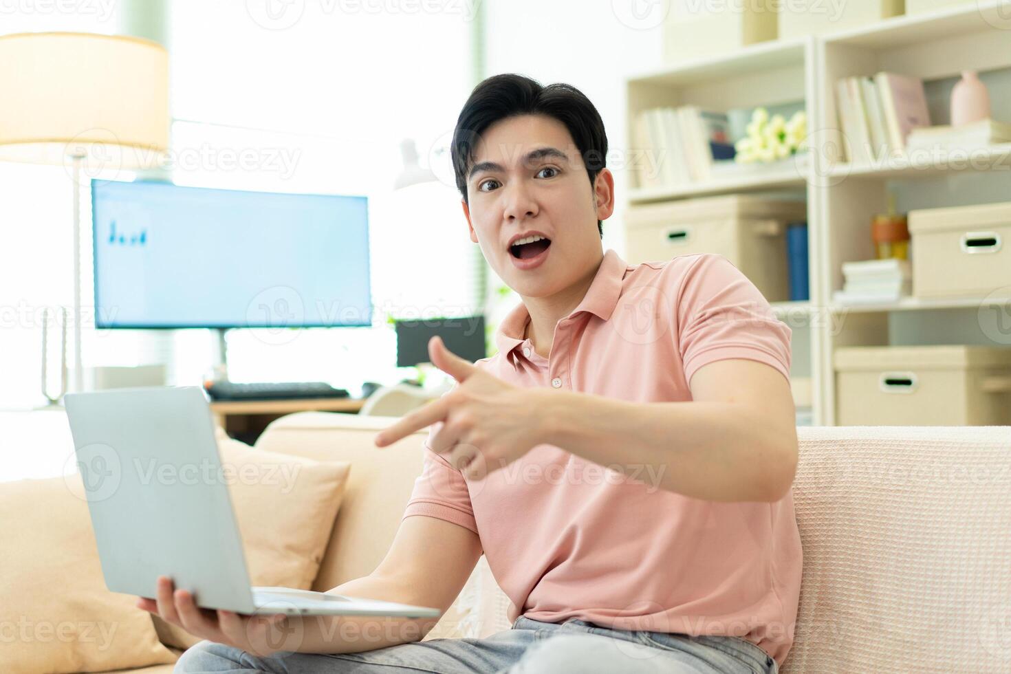 Photo of young Asian man at home