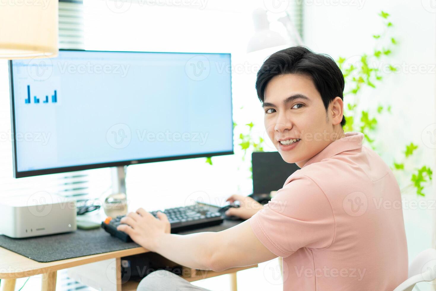 Photo of young Asian man at home