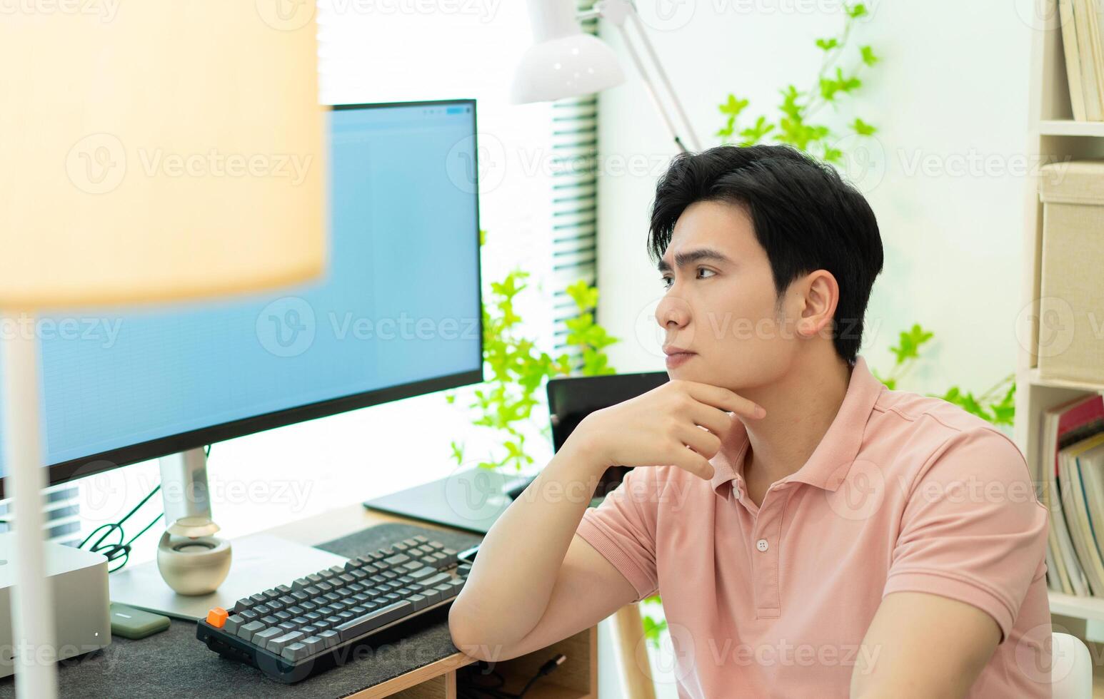 Photo of young Asian man at home