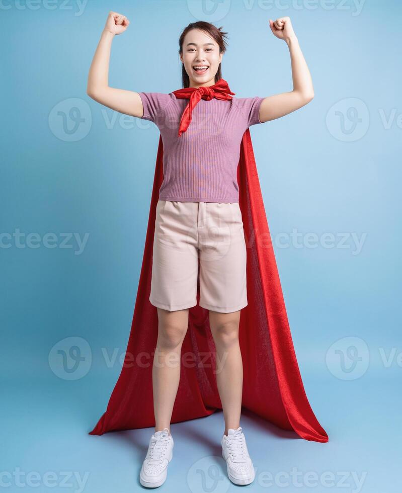 Young Asian woman wearing a red cloak photo