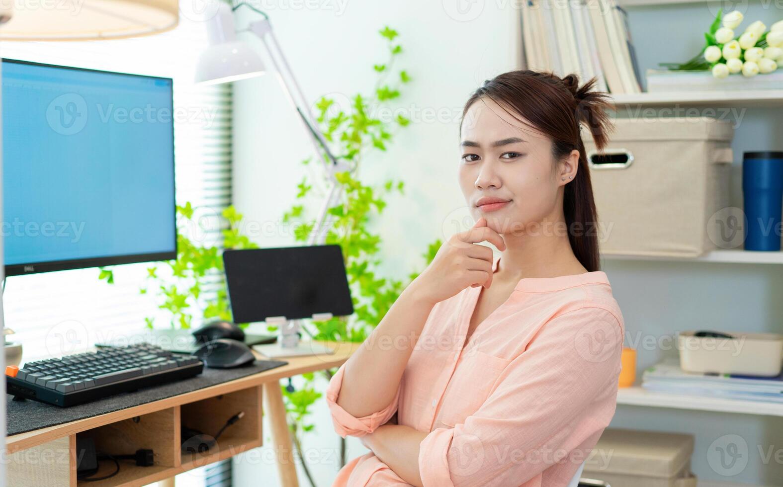 Young Asian woman at home photo