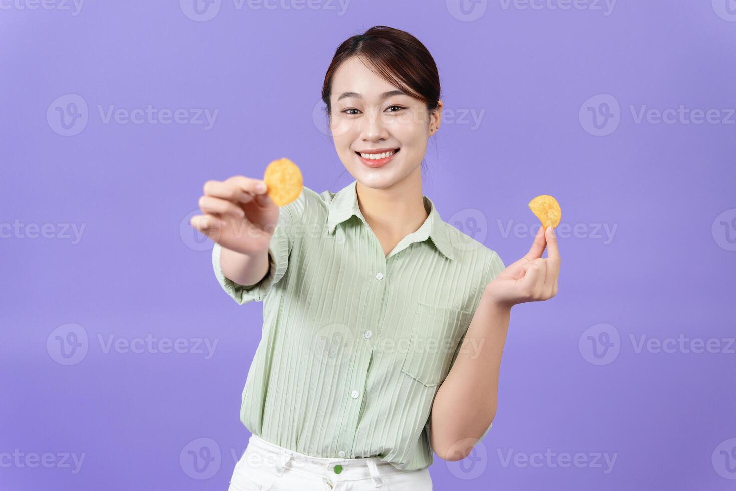 Photo of young Asian woman on purple background